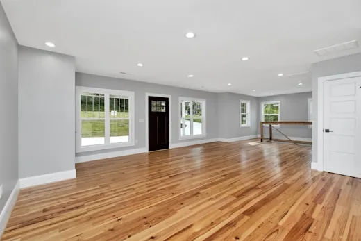 Empty room with a wide plank oak floor
