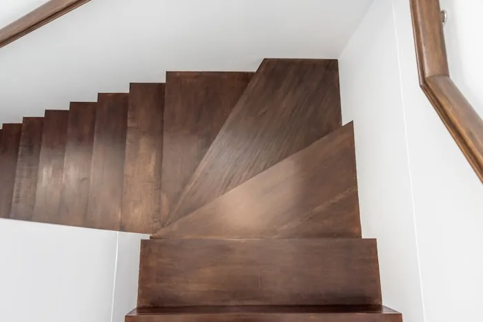 Dark walnut winder staircase
