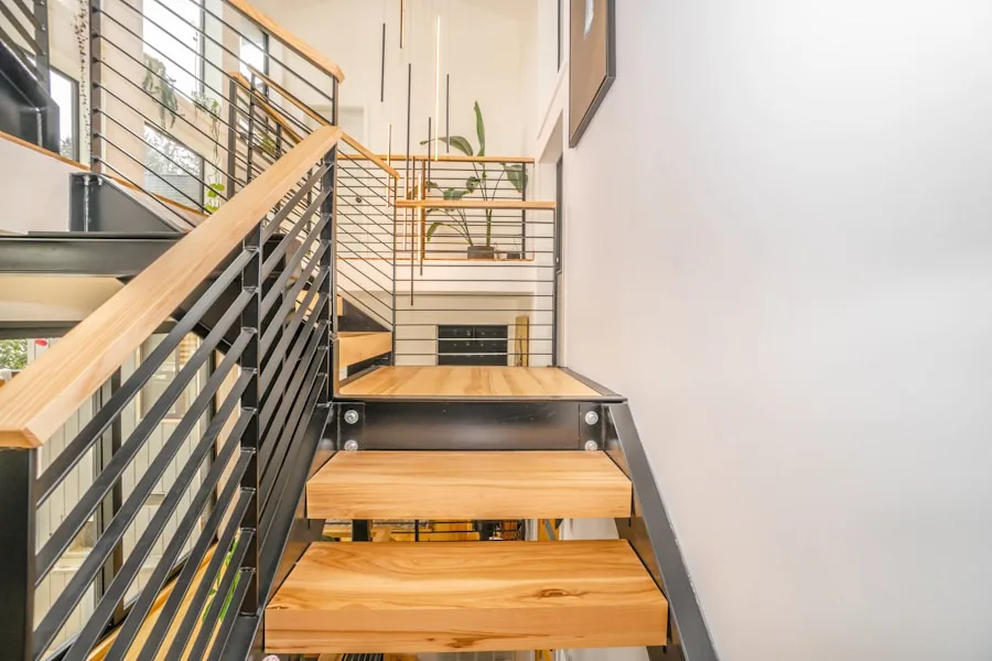 Wood stair treads with a horizontal steel railing